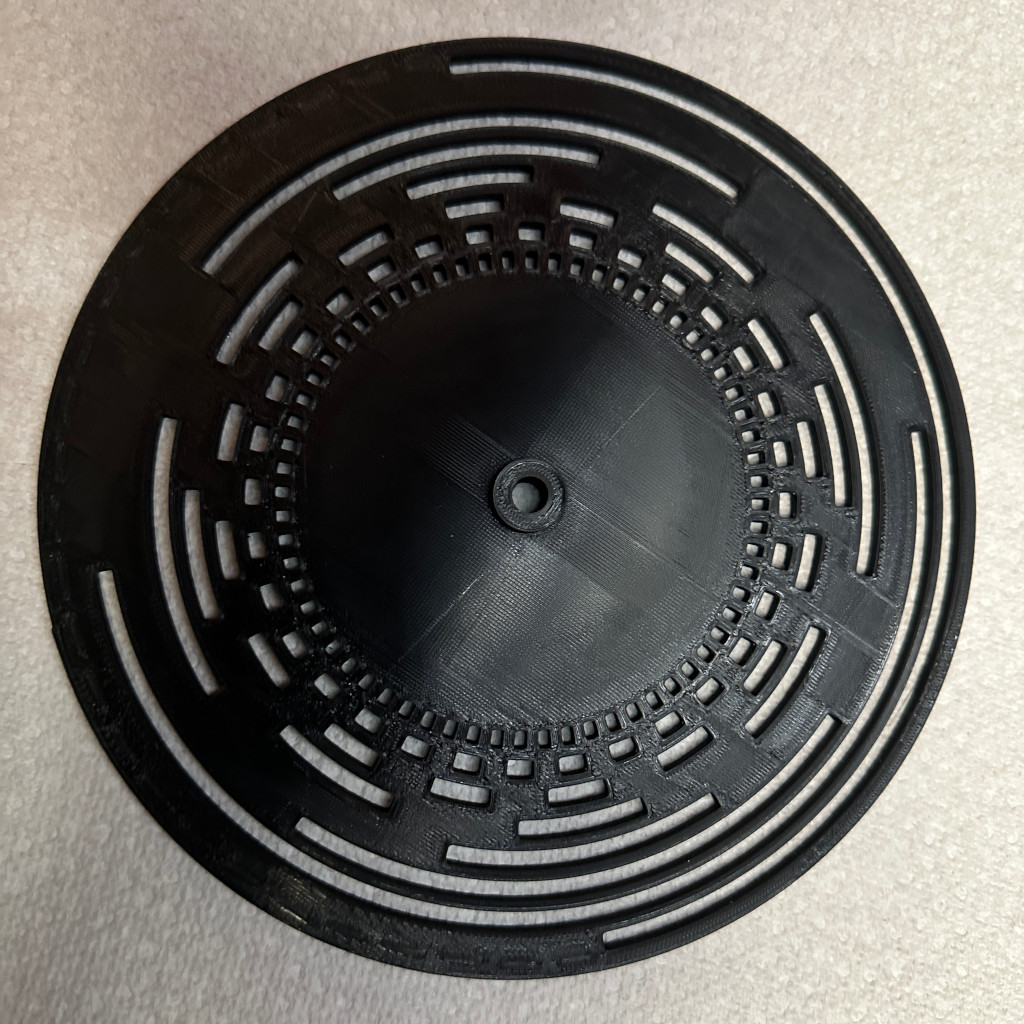 Incorrectly built disk with LSB on the interior track and MSB on the outside. Also, the 1's and 0's are inverted such that the 1's are opaque and the 0's are transmissive.